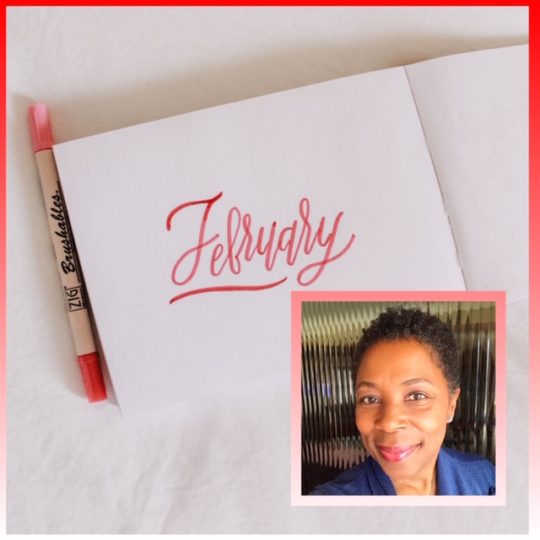 a red marker next to a white card that says February, and apicture of a woman smiling in a blue sweater in the lower right hand corner of the image
